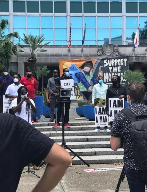 JOTPY highlights ongoing silences and the challenging imperative to correct them. The workers hosting a socially distanced press conference here are from the New Orleans City Waste Union.